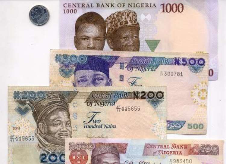 <b>Nigeria is to revert to paper banknotes, the country's central bank has announced, in a policy switch bucking a growing trend around the world for tougher polymer-based currency..  By Pius Utomi Ekpei (AFP/File)</b>